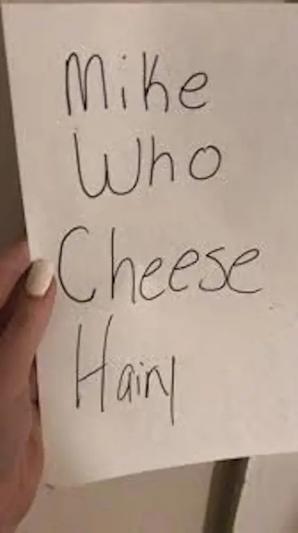 A TikTok of a person about to do the Mike Who Cheese Hairy trend