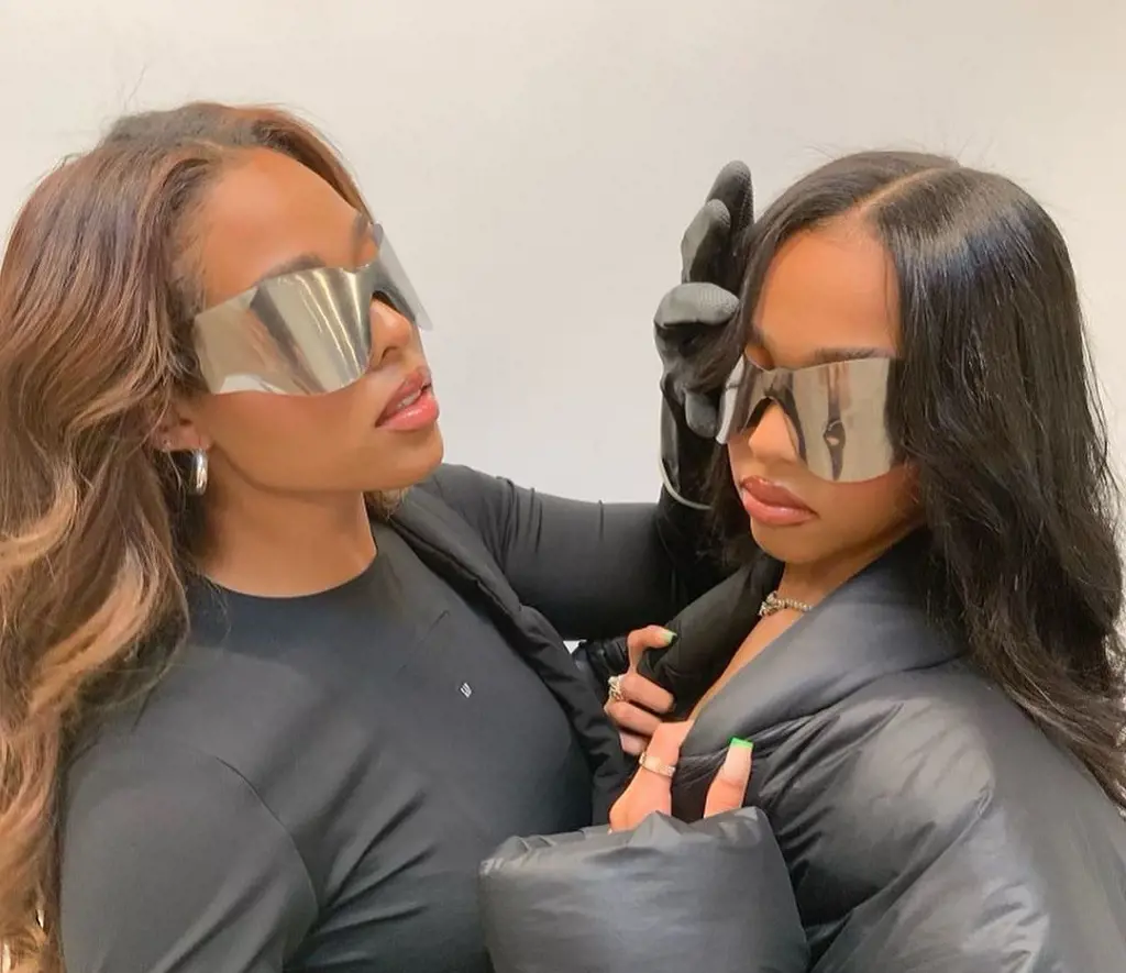 Jordyn and her sister, Jodie posing with the Yeezy shades.