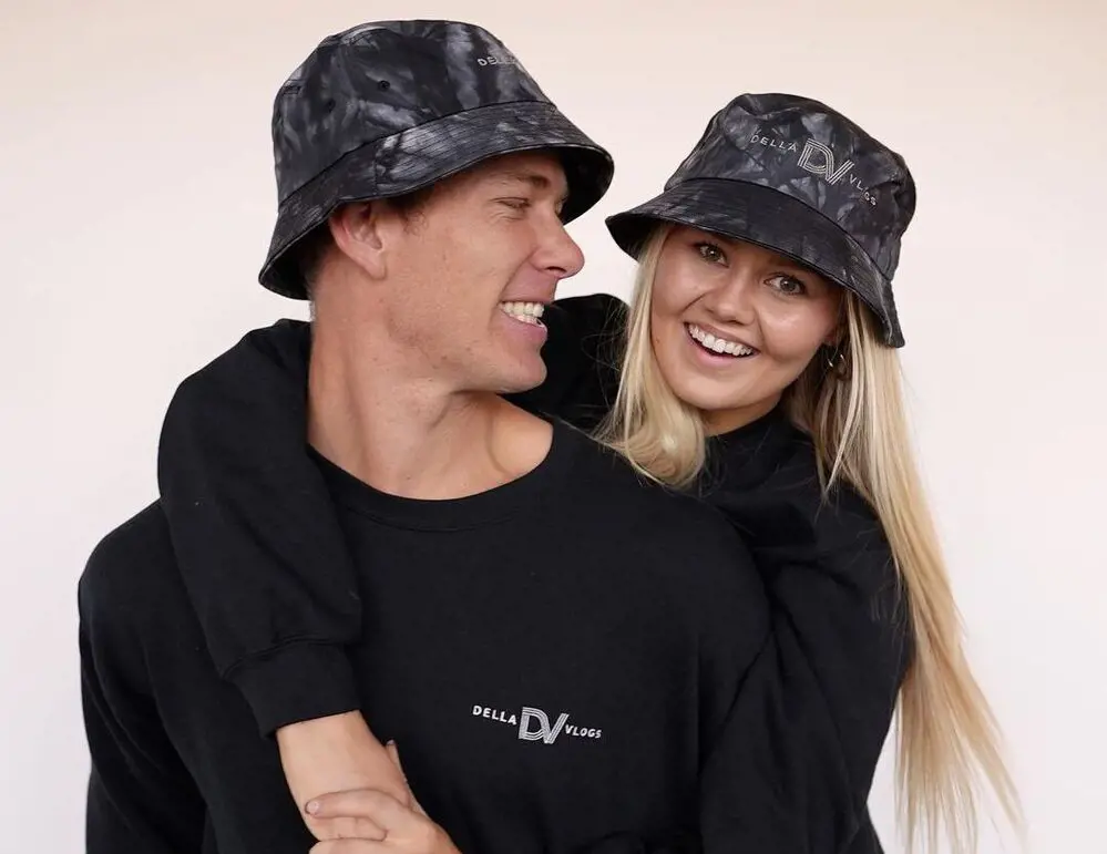 Dallin and Bella wearing apparels from their Merch