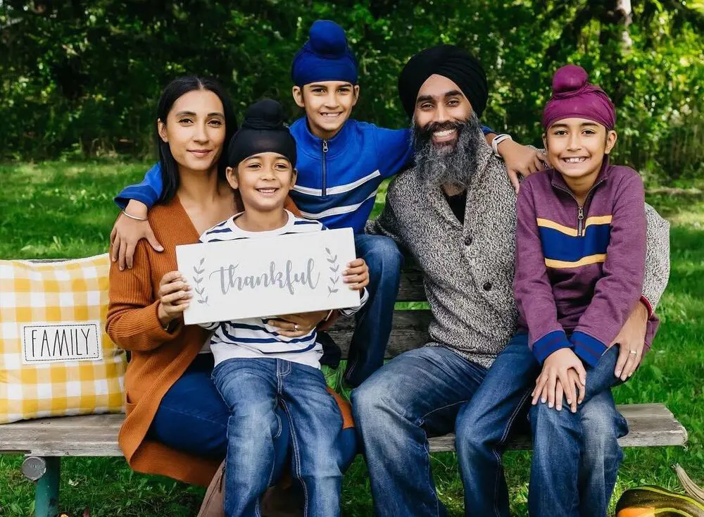 Tina Singh with her husband, Herpreet and three sons.