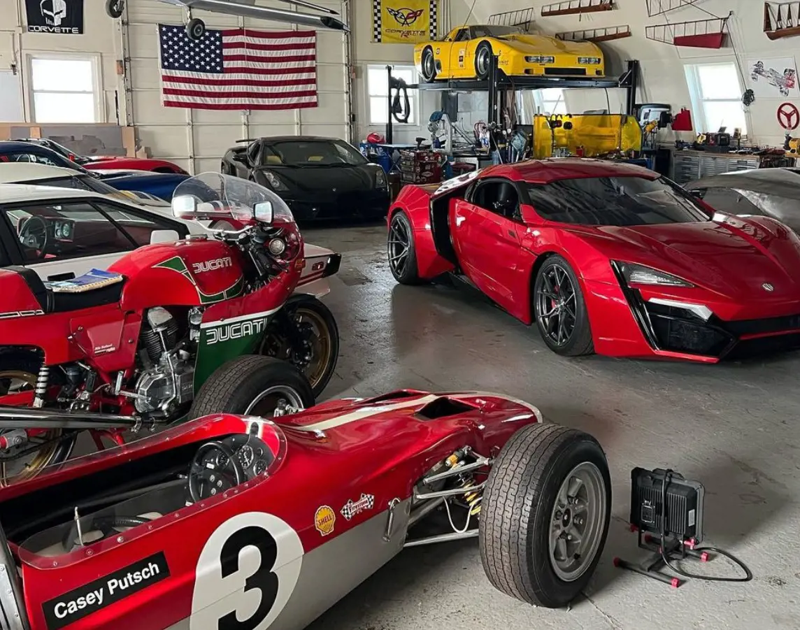 Casey Putsch with his cars in his Genius Garage