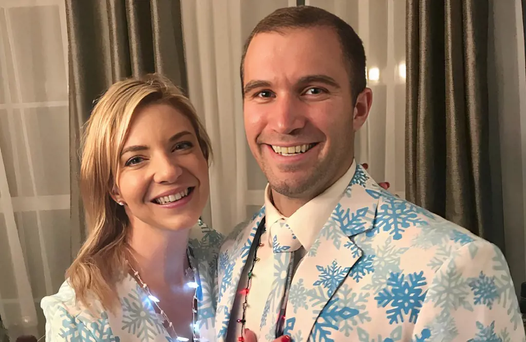 Jessica and Jon striking a pose after Christmas party wearing matching snow flakes themes dress in December 2018