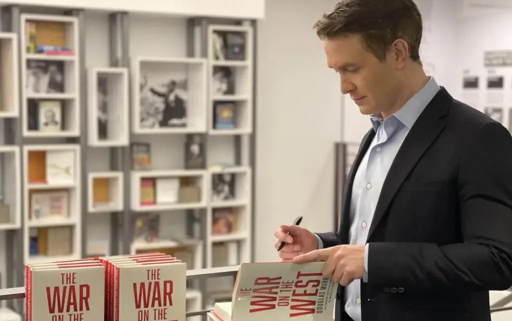 Douglas signing the first copies of The War on the West in New York on April 7, 2022