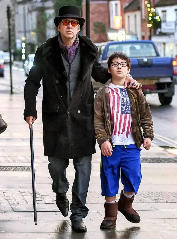 Nicolas (Holding A Cane) and Kal-El Walking On The Streets 