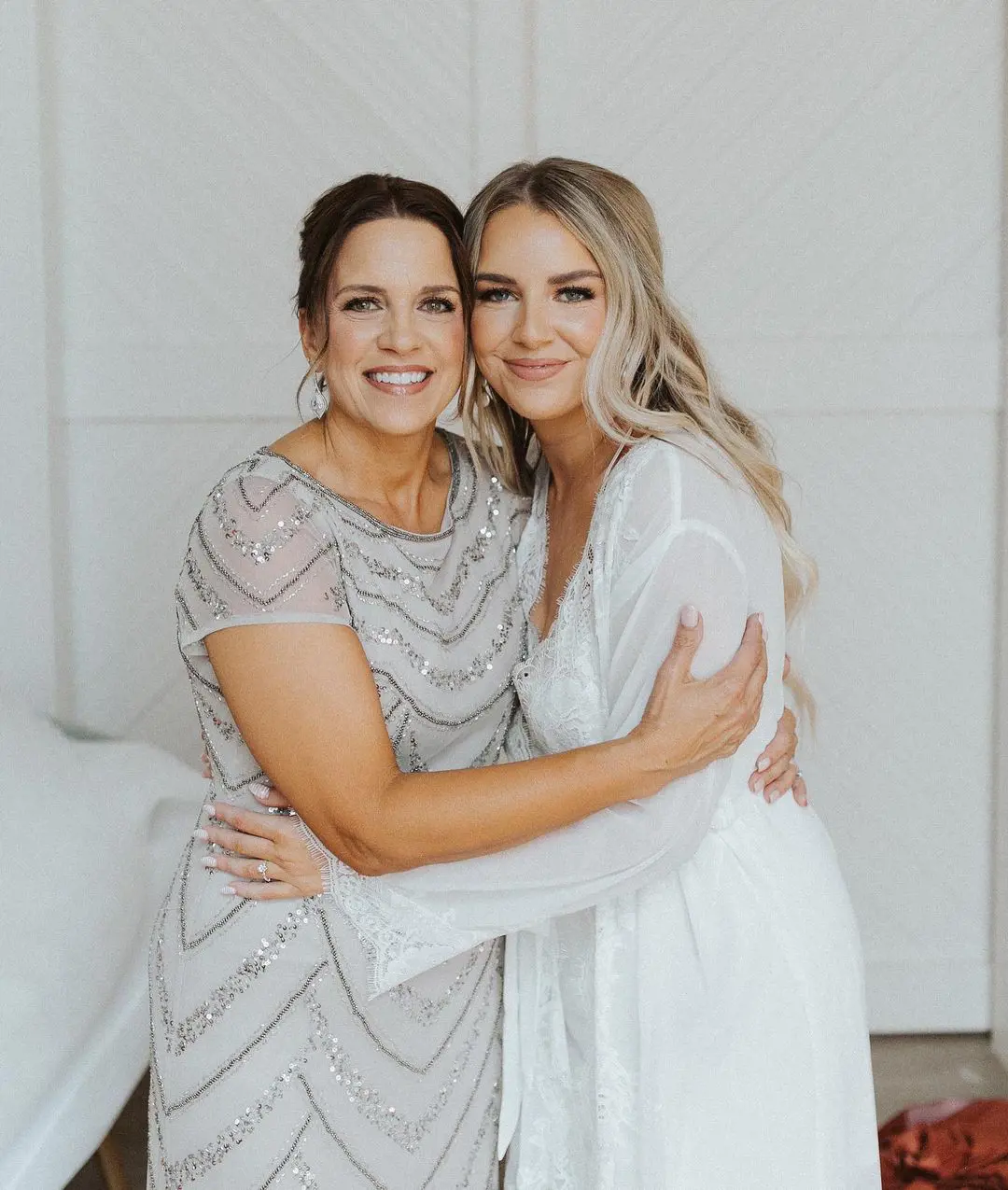 Jodi Ballard Hutto looks delighted as she hugs her daughter Mackayla on the day of her wedding 