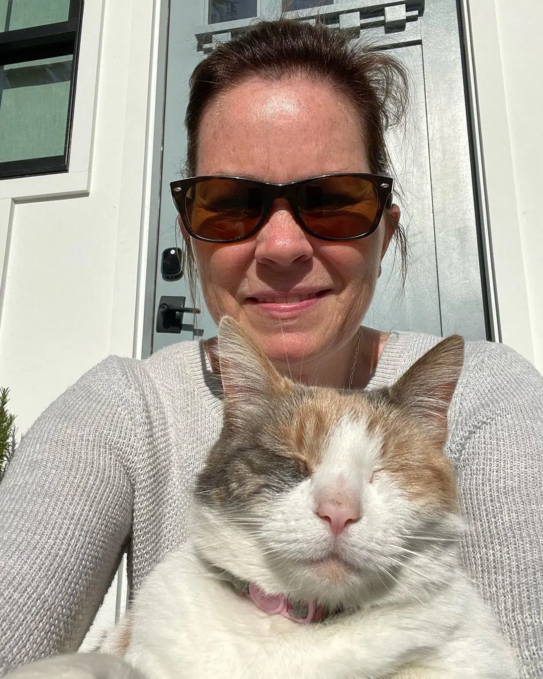 LeeAnn Took A Selfie While Sunbathing With Her Cat On 15 April 2023